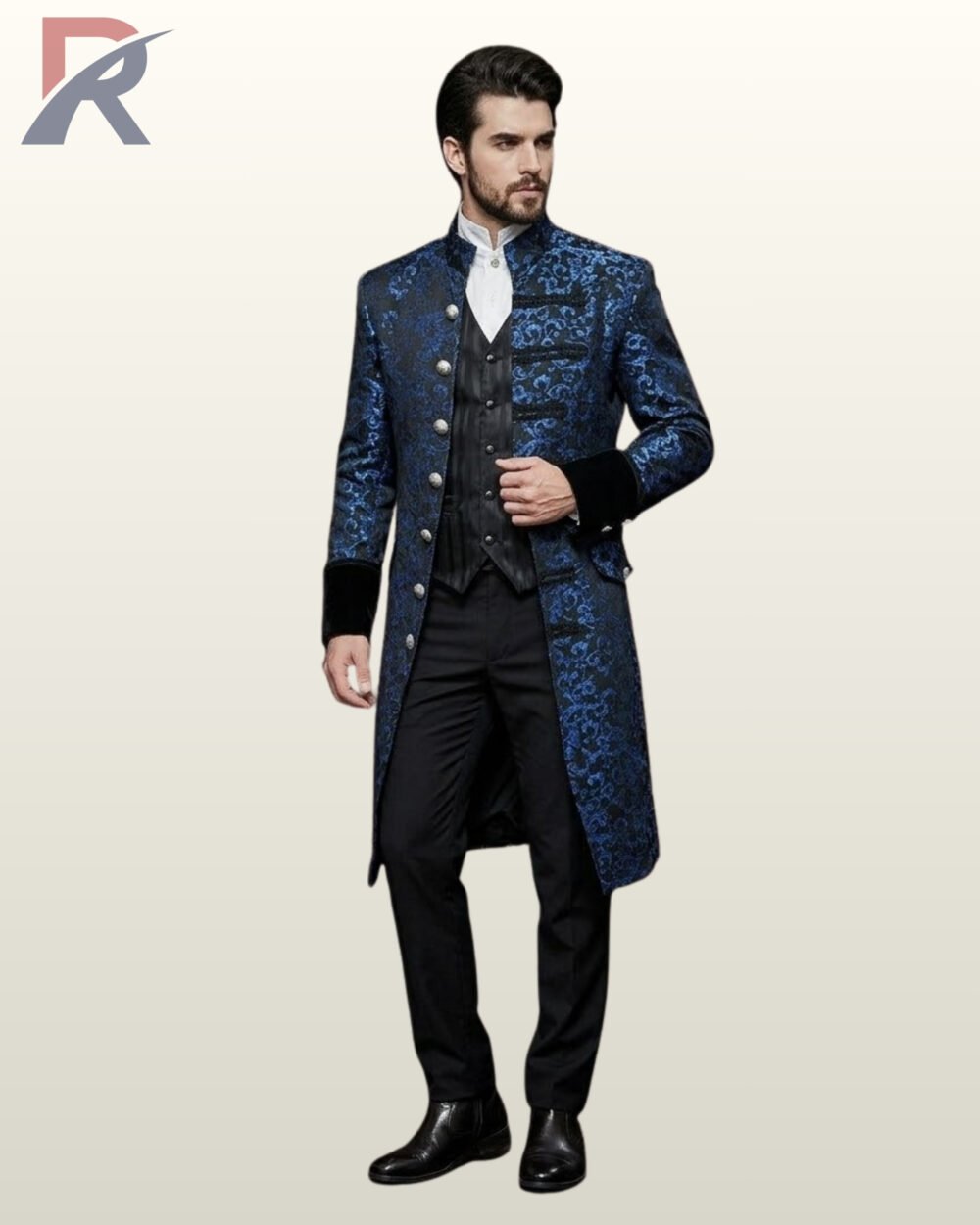 Men's ornate blue floral brocade Victorian overcoat styled over a black vest, high standing collared shirt, and tailored black trousers.