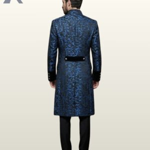 Back perspective of a men's blue floral brocade Victorian tailcoat showing velvet sleeve cuff bands, standing collar, and black dress pants.