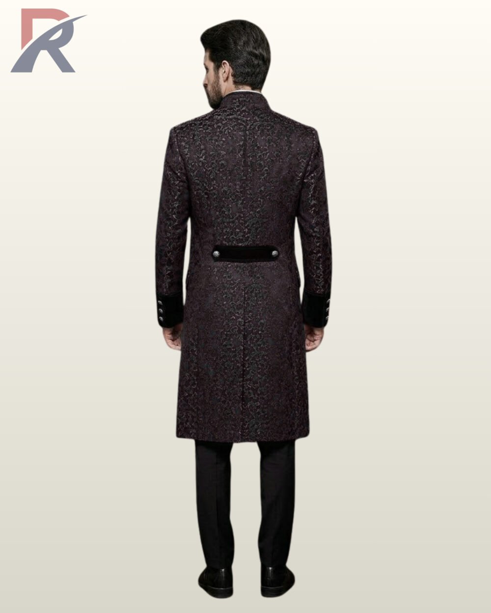Full rear model view of a men's dark plum purple damask gothic frock coat highlighting a black velvet back waist belt and center seam split.