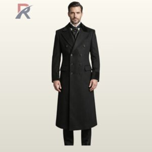 Men's formal Edwardian style black overcoat styled with a black silk ascot tie, featuring peak velvet lapels and six-button front closure.
