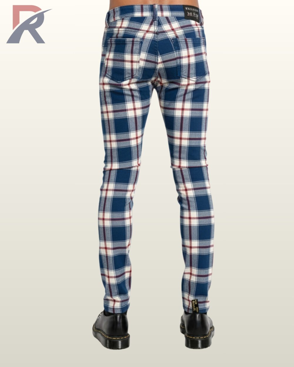 Stylish blue and white checkered slim trousers worn with alternative rock shoes.