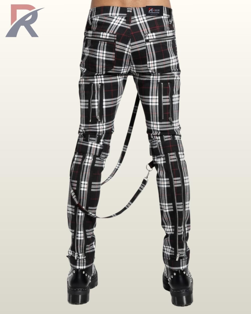 Gothic punk tartan skinny trousers featuring decorative zippers, rings, and chains.