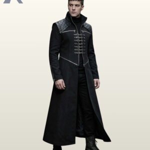 Three-quarter model view of a men's black gothic trench coat with diamond-quilted shoulders, silver D-ring chest clasps, and zipped sleeve cuffs.