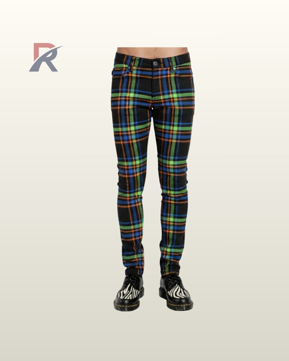 Full front view of a male model wearing men's black skinny punk pants featuring neon green, blue, and orange tartan plaid stripes.