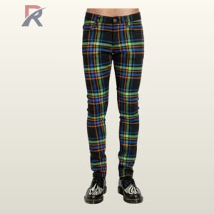 Full front view of a male model wearing men's black skinny punk pants featuring neon green, blue, and orange tartan plaid stripes.