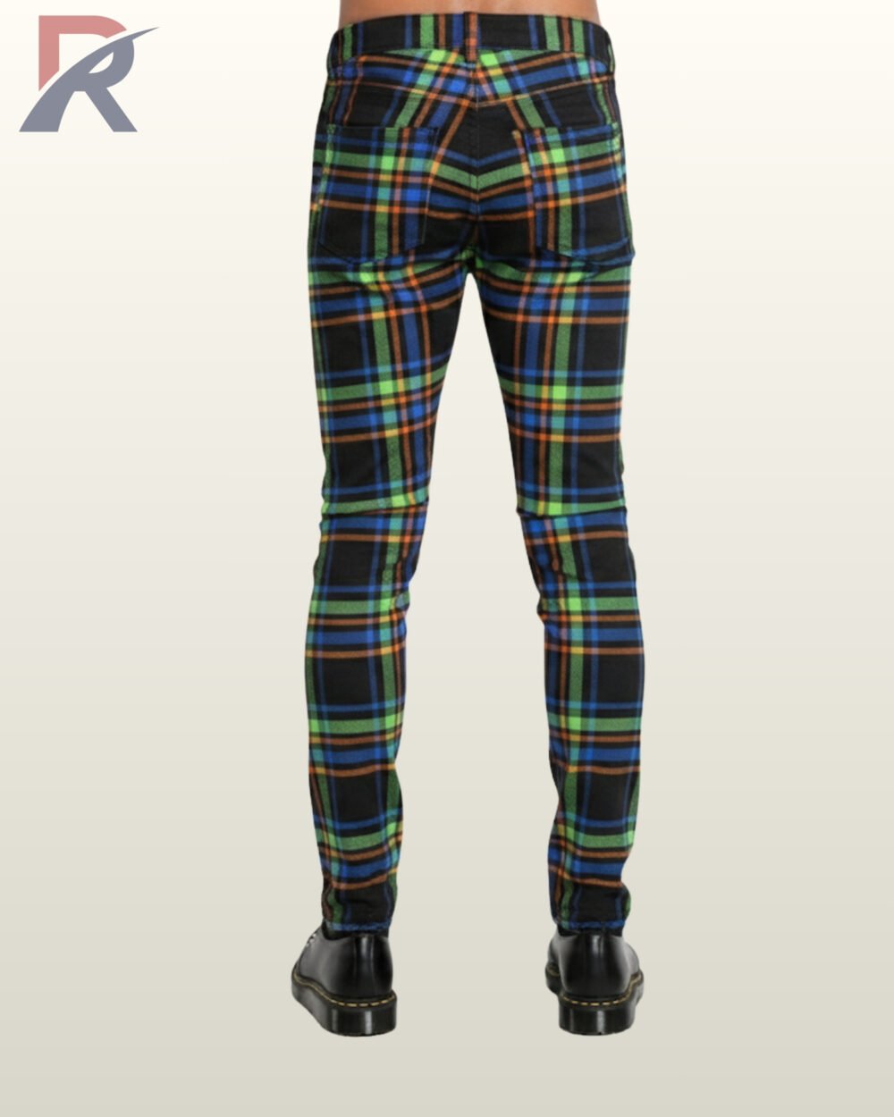 Back perspective of men's neon multi-color checkered gothic trousers featuring fitted leg construction and black leather shoes.