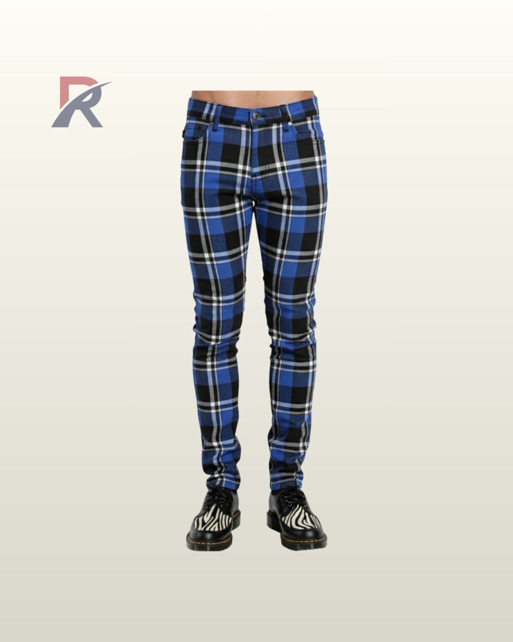 Full front view of a male model wearing men's cobalt blue, black, and white tartan plaid skinny punk pants with a button waistband.
