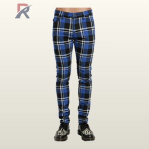 Full front view of a male model wearing men's cobalt blue, black, and white tartan plaid skinny punk pants with a button waistband.