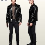 Side-by-side front and profile view of a model wearing a high-gloss black patent leather biker jacket featuring an asymmetrical zipper and waist belt.