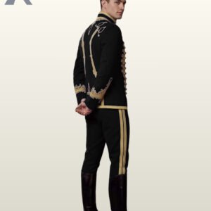 Three-quarter side shot of a men's black parade tunic suit displaying gold shoulder braid work, standing mandarin collar, and tall black leather riding boots.