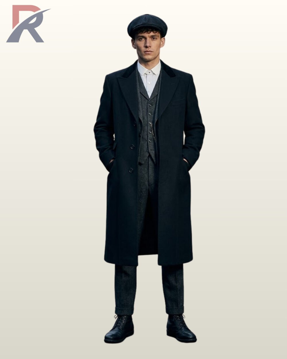 Full front view of a model wearing an open black wool single-breasted overcoat over a grey tweed three-piece suit, pocket watch chain, and newsboy cap.