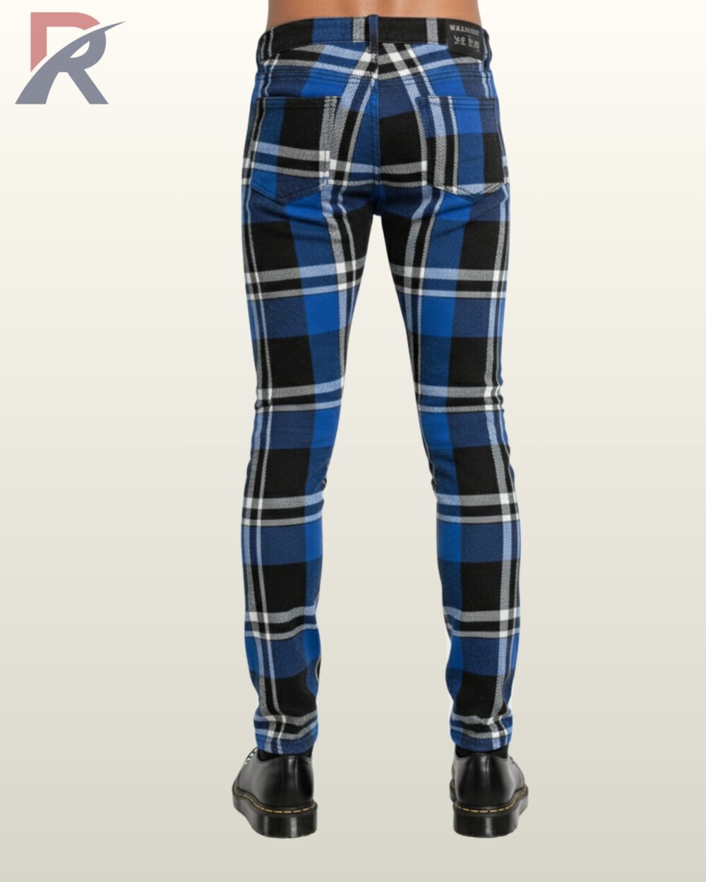 Full rear view of a male model wearing men's cobalt blue and black tartan plaid skinny punk pants featuring back patch pockets and belt loops.