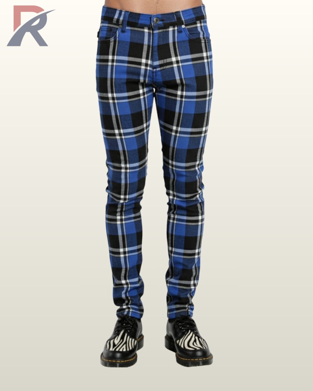 Men's slim-fit cobalt blue checkered gothic trousers styled with black leather zebra-print oxfords.