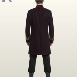 Back perspective of a men's victorian parade tunic coat displaying clean shoulder tailoring, burgundy velvet cuffs, and black combat boots.