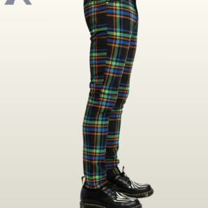 Side profile view of a model wearing men's black skinny punk trousers with vibrant neon green, orange, and blue tartan grid lines.