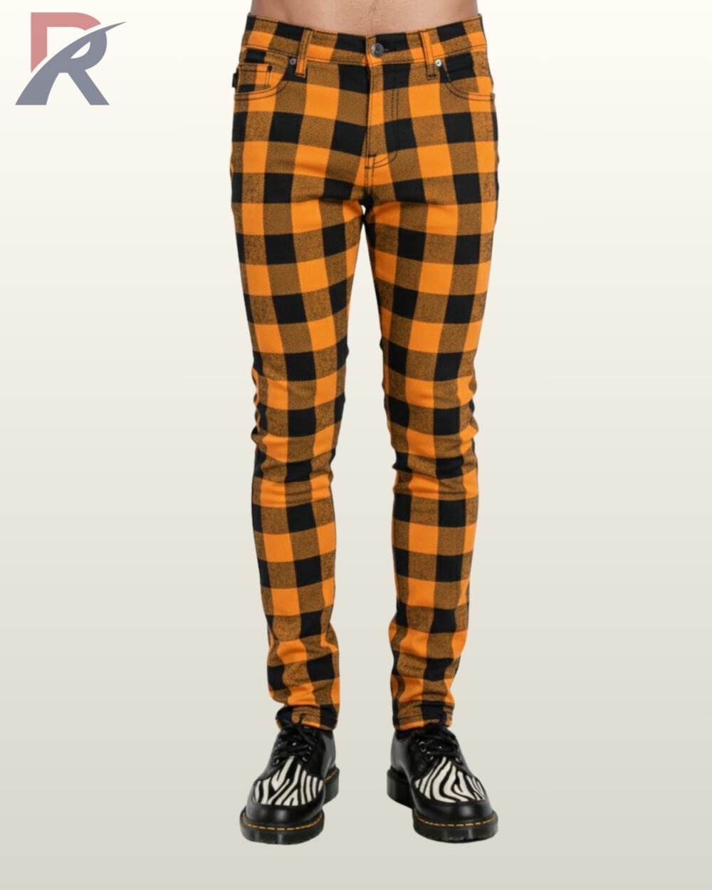 Front view of punk style orange and black checkered trousers on a model.