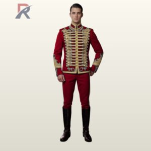Full front view of a male model wearing a crimson red hussar military jacket with detailed gold braid chest bars, double row brass buttons, and embroidered cuffs.