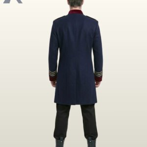 Full rear view of a male model wearing a navy blue military officer coat showcasing burgundy velvet collar trim, gold sleeve braid, and tailored back seams.