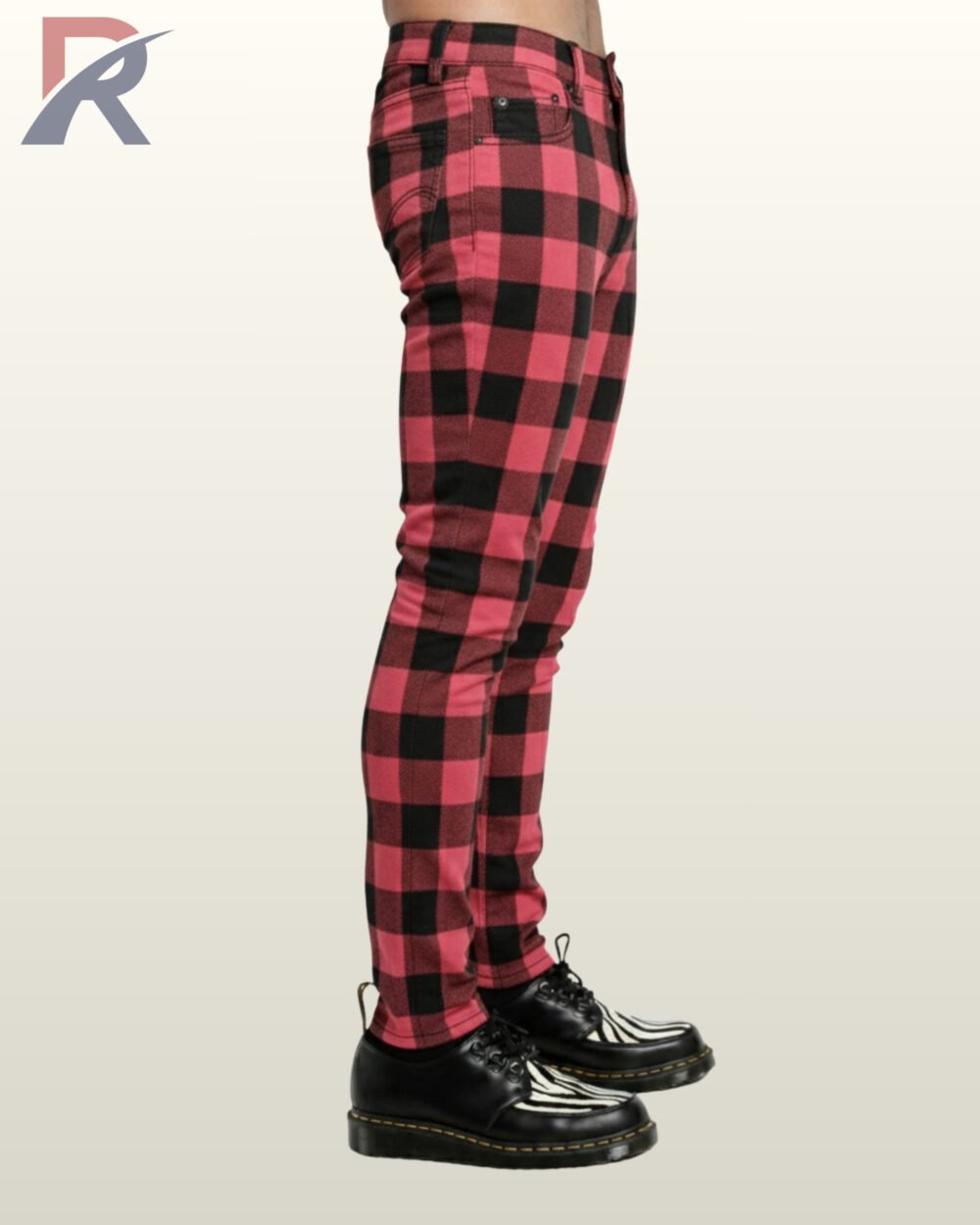 Close-up of slim-cut alternative trousers showcasing a pink and black tartan motif.