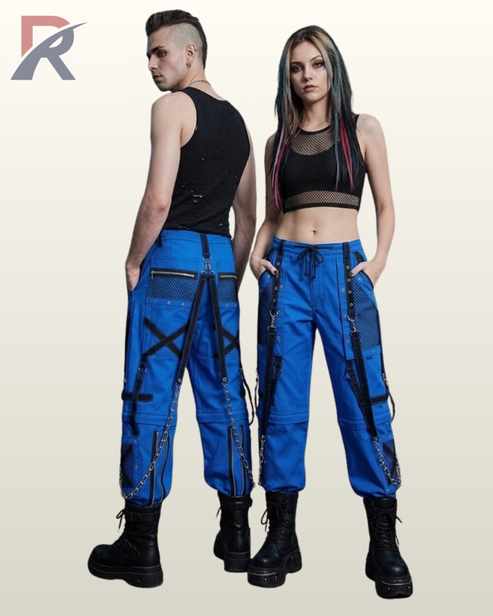 Couple wearing royal blue gothic cargo pants featuring black eyelet straps, mesh pockets, and hanging silver-tone chains.