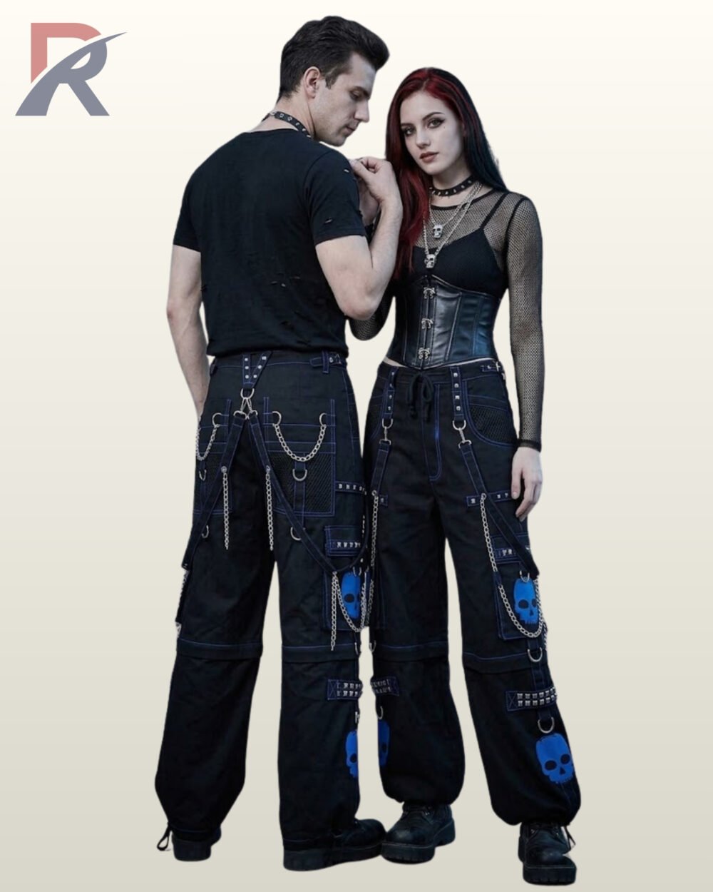Couple in black alternative wide-leg trousers highlighting blue skull graphics and silver-tone metal hardware.