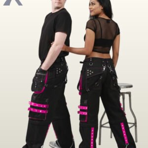 Side and back view of a couple wearing black gothic cargo pants accented with vivid hot pink studded straps, pockets, and hanging chains.
