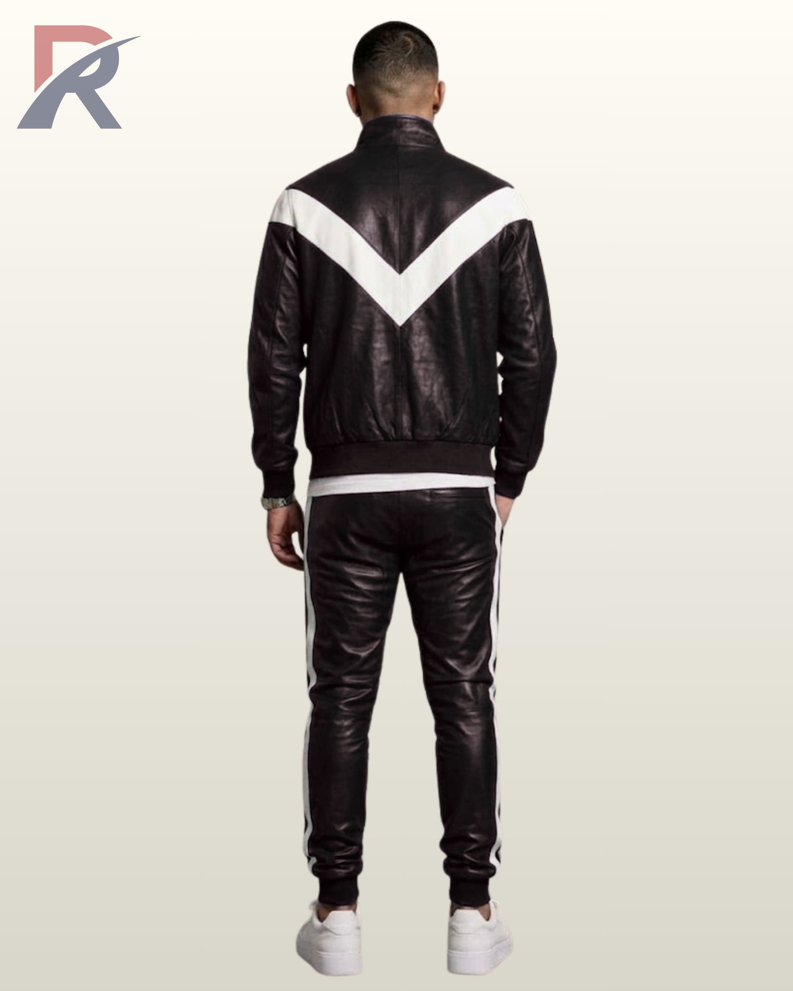 Complete men's black leather tracksuit set styled with white low-top sneakers.