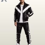 Classic black leather sports suit featuring a zip jacket and elastic cuffed track pants.