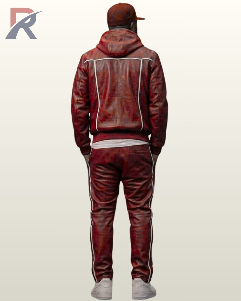 Streetwear styled red leather two-piece athletic suit with hoodie paired with white sneakers.