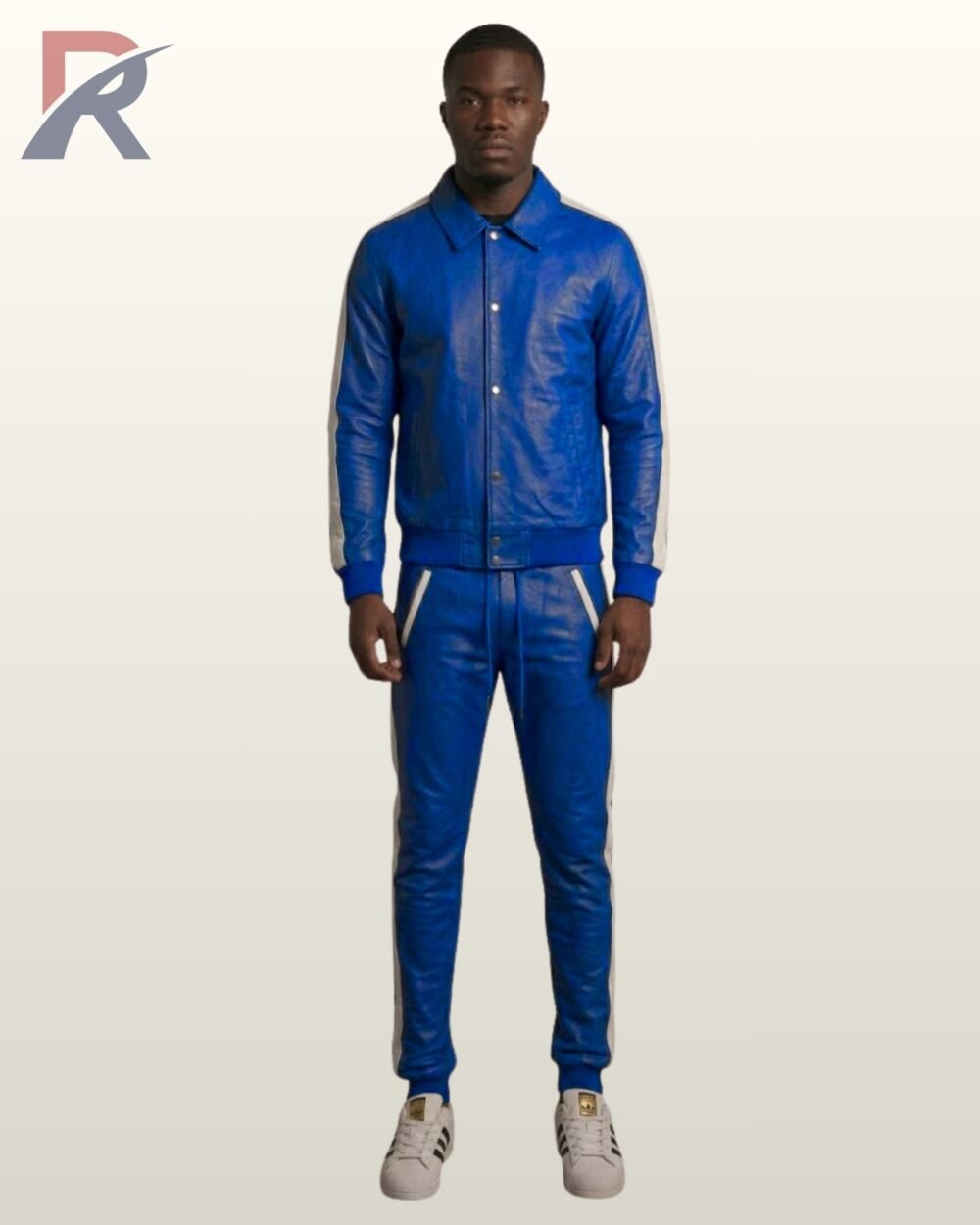 A model in a cobalt blue leather button-up jacket and joggers.