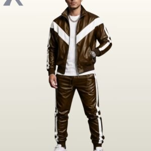 Men's brown leather zip jacket and cuffed joggers matching set styled with white sneakers.