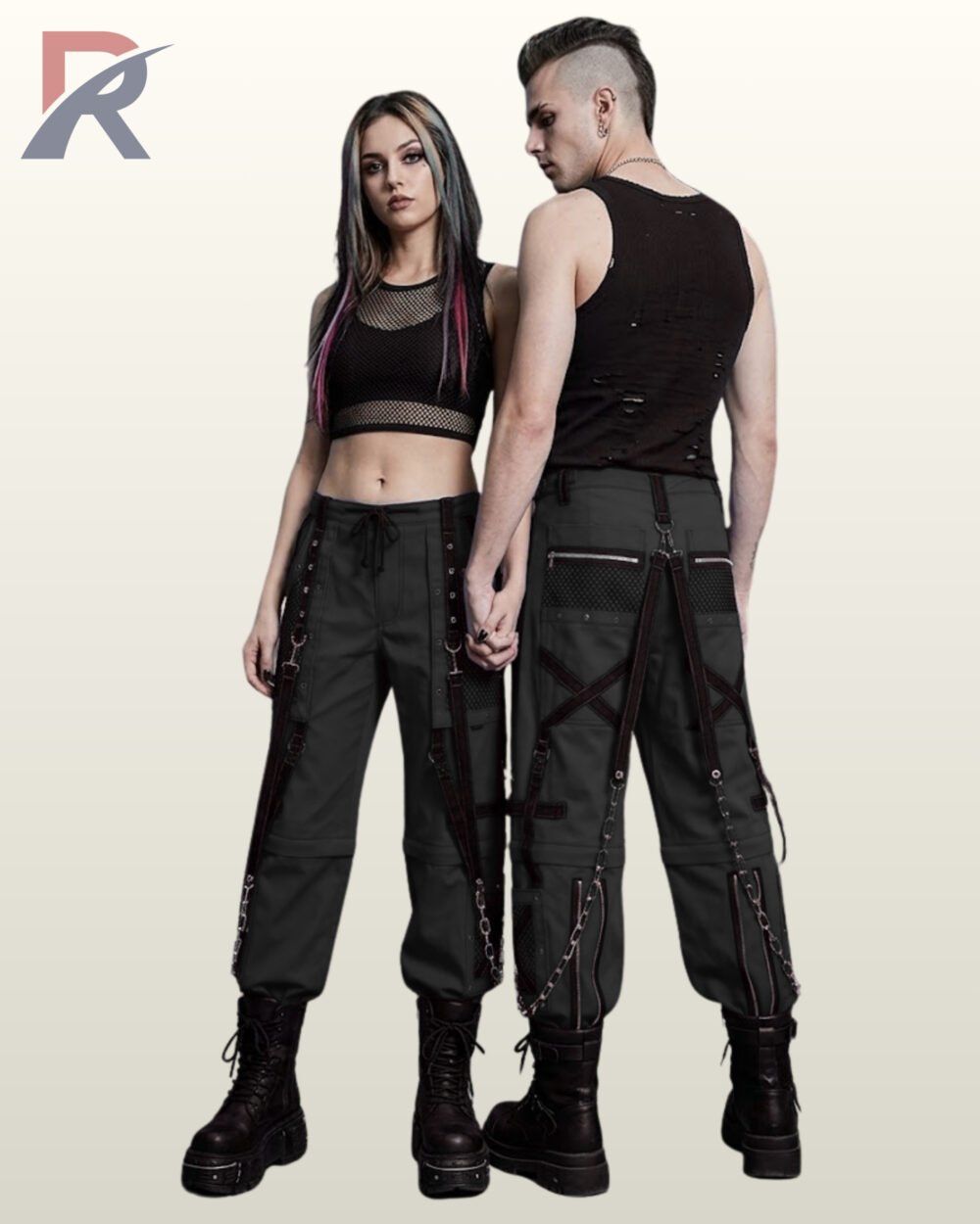 Man and woman wearing monochrome dark grey techwear trousers accented with black bondage straps and silver chains.