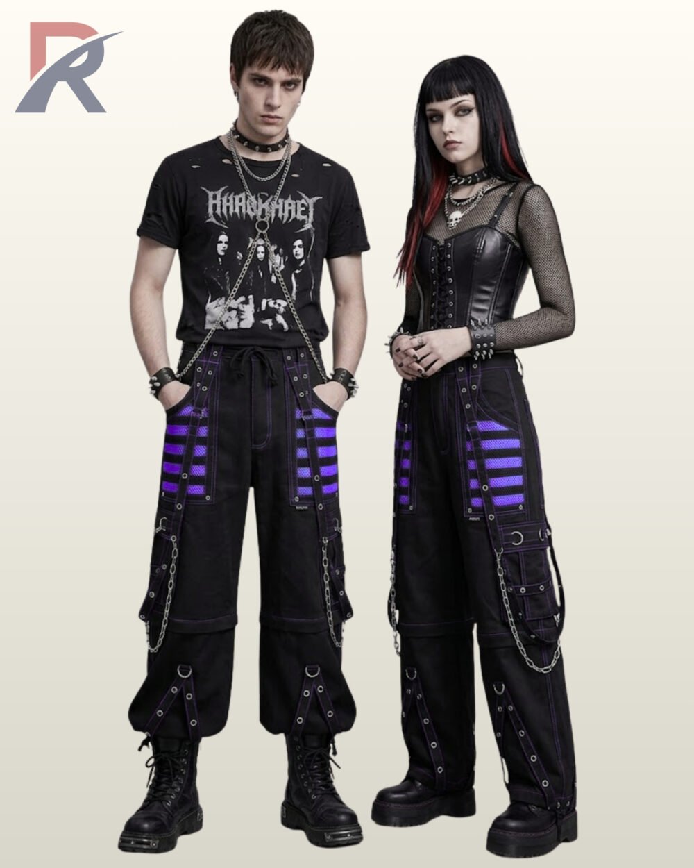 Couple wearing matching black gothic cargo pants featuring purple mesh panels, metal chains, and eyelet straps.