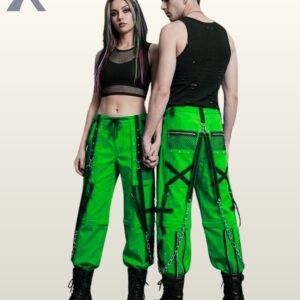 Man and woman posing in neon green alternative streetwear trousers featuring black eyelet straps and hanging silver chains.