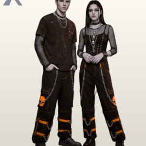 Full model view of a male and female wearing black gothic skull cargo pants with pumpkin orange contrast stitching, orange skull graphics, and metal chains.