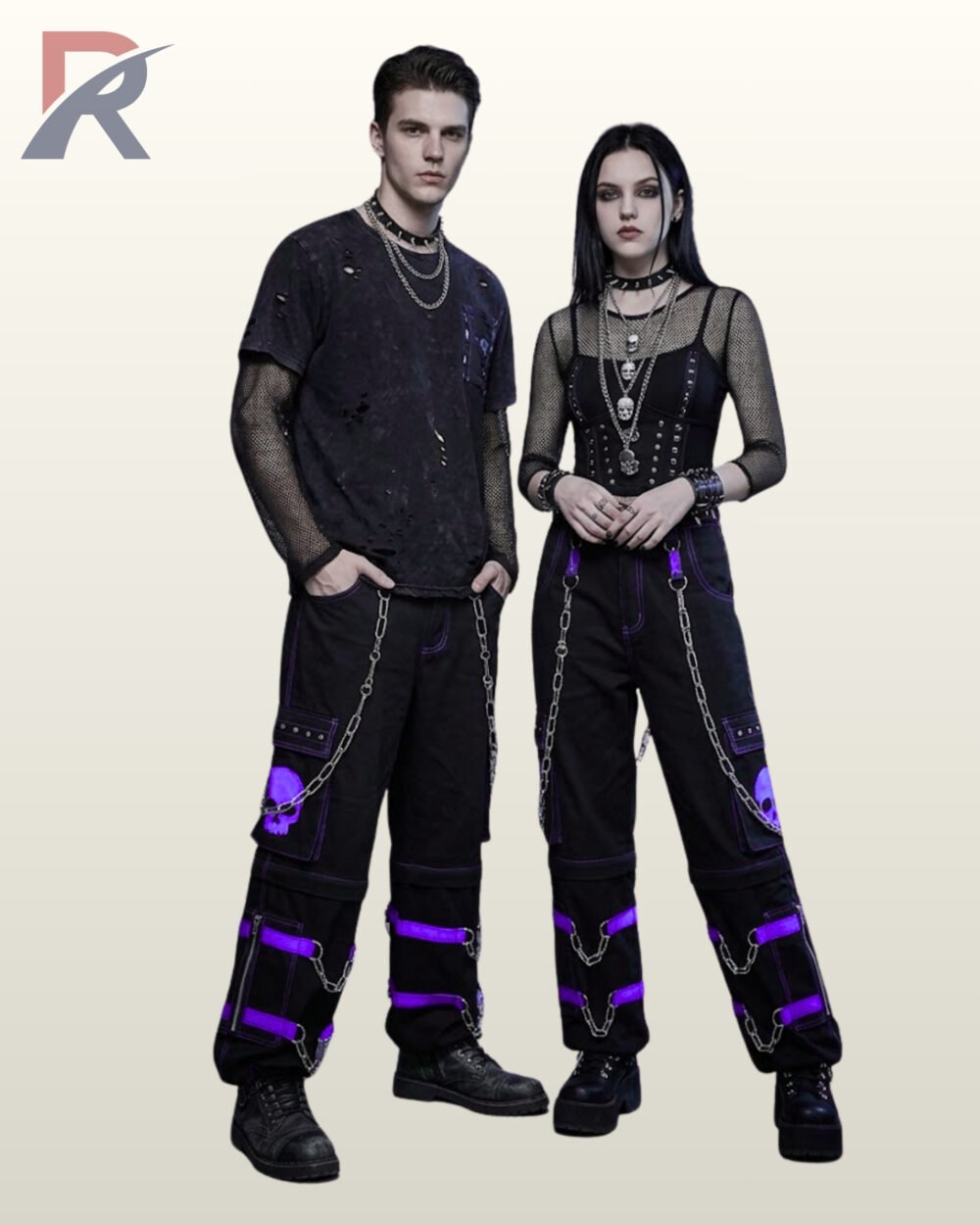 Full model view of a male and female wearing black gothic skull cargo pants with vivid purple contrast stitching, purple skull pocket graphic, and metal chains.
