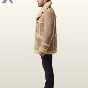 A close-up shot of a men's luxury tan sheepskin car coat featuring visible fur seams and button closures.