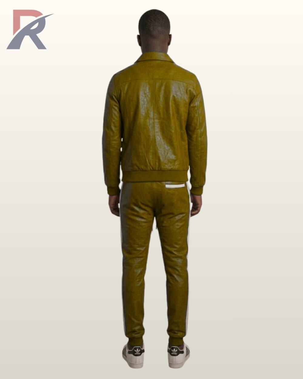 A man wearing an olive green leather streetwear tracksuit with white piping.