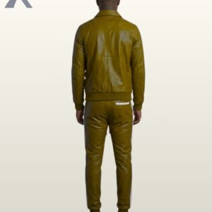 A man wearing an olive green leather streetwear tracksuit with white piping.