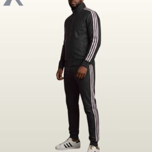 A model wearing a luxury black leather high-neck track jacket with matching slim-fit leather joggers.