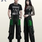 Couple holding hands in dark cyber goth wide-leg pants featuring neon green mesh detail and silver hardware.