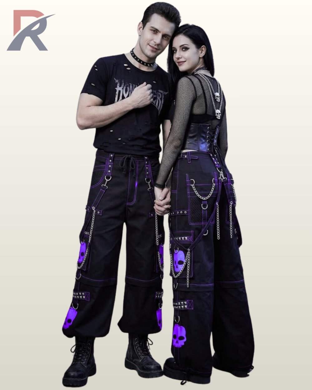 Man and woman wearing loose-fit black gothic cargo pants accented with purple contrast piping, skull motifs, and hanging chains.