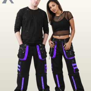 Front view of a couple posing in matching black gothic wide-leg cargo pants featuring purple trim, metal studs, and hanging chains.