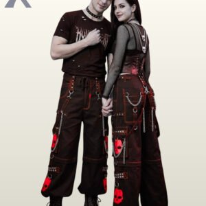 Man and woman modeling wide-leg industrial goth trousers with red skull graphics and hanging silver-tone chains.