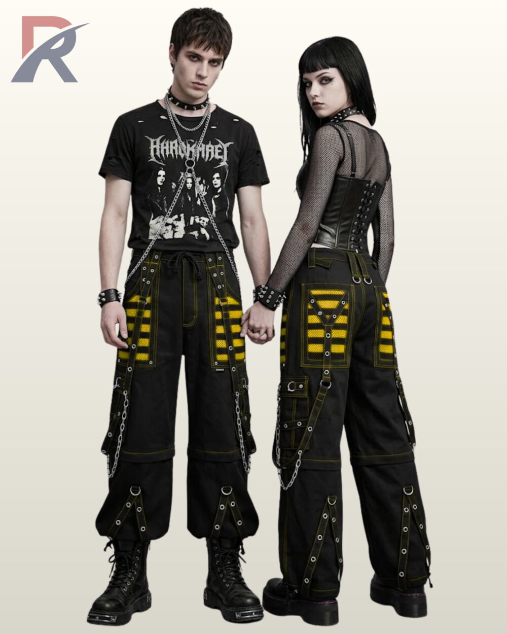Man and woman wearing cyberpunk wide-leg cargo pants with yellow mesh panels and ring strap details.