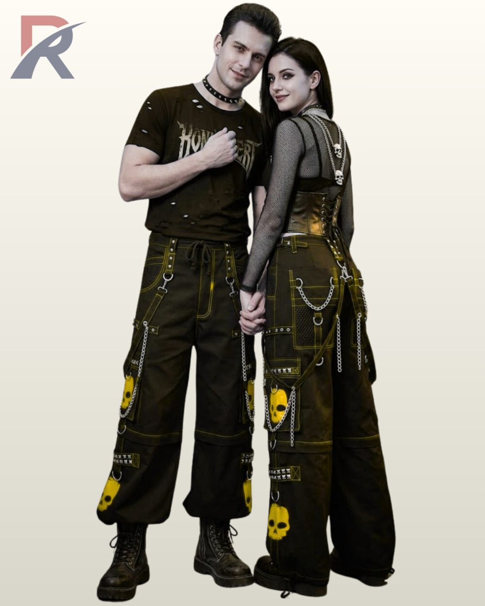 Man and woman posing in cyberpunk wide-leg cargo trousers featuring yellow skull accents and metal ring hardware