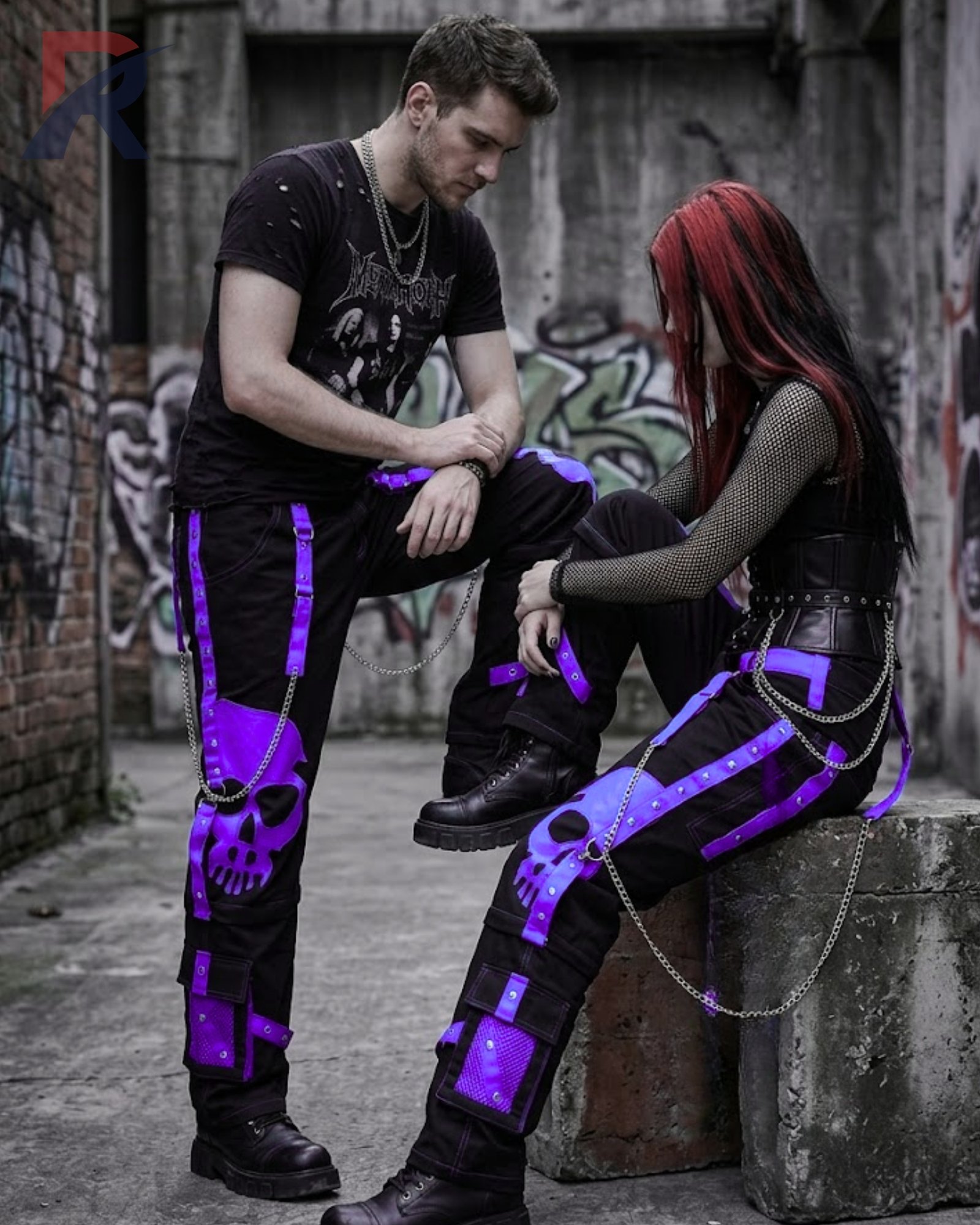 Baggy alternative style black cargo trousers featuring purple contrast straps and metallic hardware.