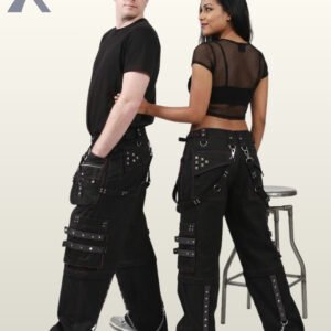 Side and back view of a couple in black gothic cargo pants styled with monochrome black studded straps, utility pockets, and hanging silver chains.
