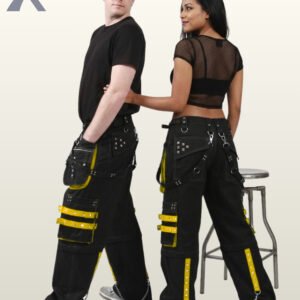 Side and back view of a couple wearing black gothic wide-leg cargo pants featuring bright yellow studded straps and hanging metal chains.