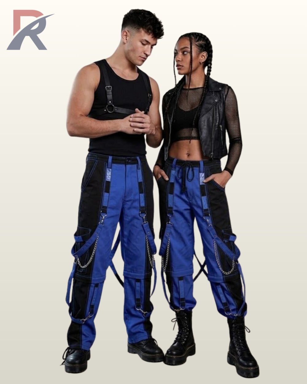 Full model view of a male and female wearing black and royal cobalt blue two-tone gothic bondage cargo pants with hanging silver chains and D-rings.